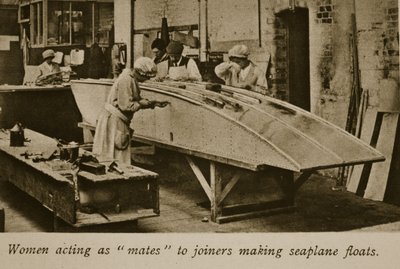 Women acting as mates to joiners making seaplane floats by English Photographer